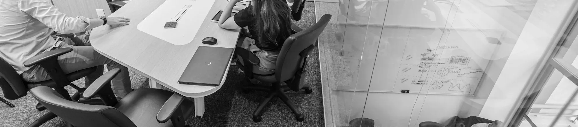 Marketing team meeting in a modern conference room reviewing strategy