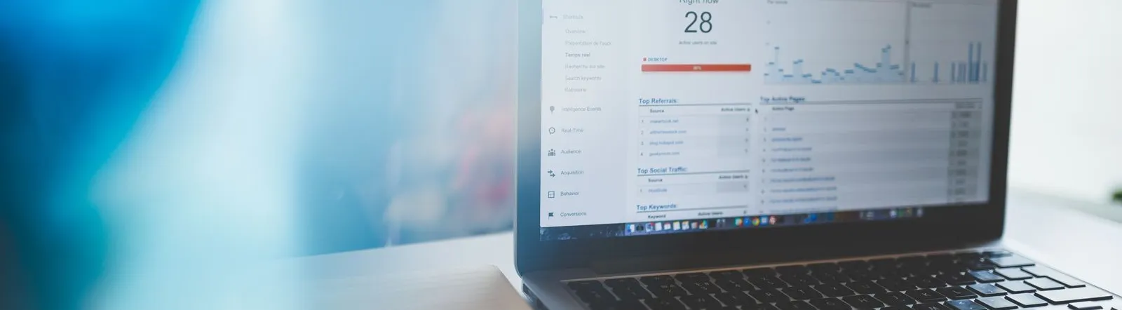 Laptop displaying Google Analytics in a modern workspace, highlighting digital analytics and technology.