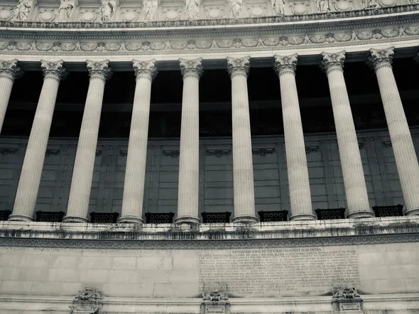 Detailed view of neoclassical columns in a government building facade.