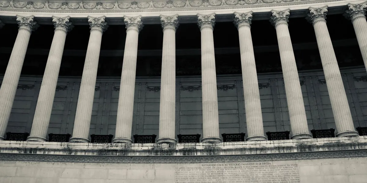 Detailed view of neoclassical columns in a government building facade.