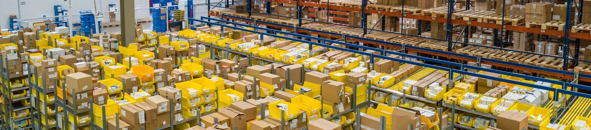 Logistics warehouse with industrial bins ready for shipping