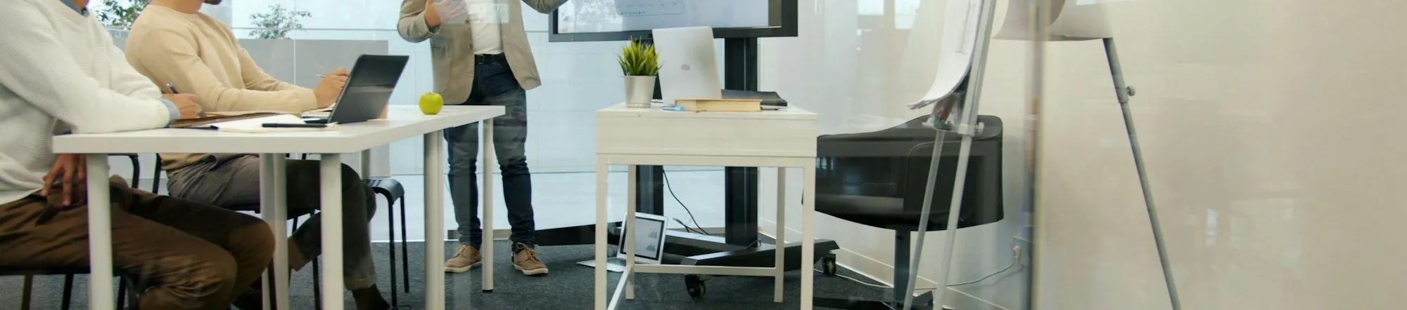 Professional presenting marketing strategy to colleagues in office