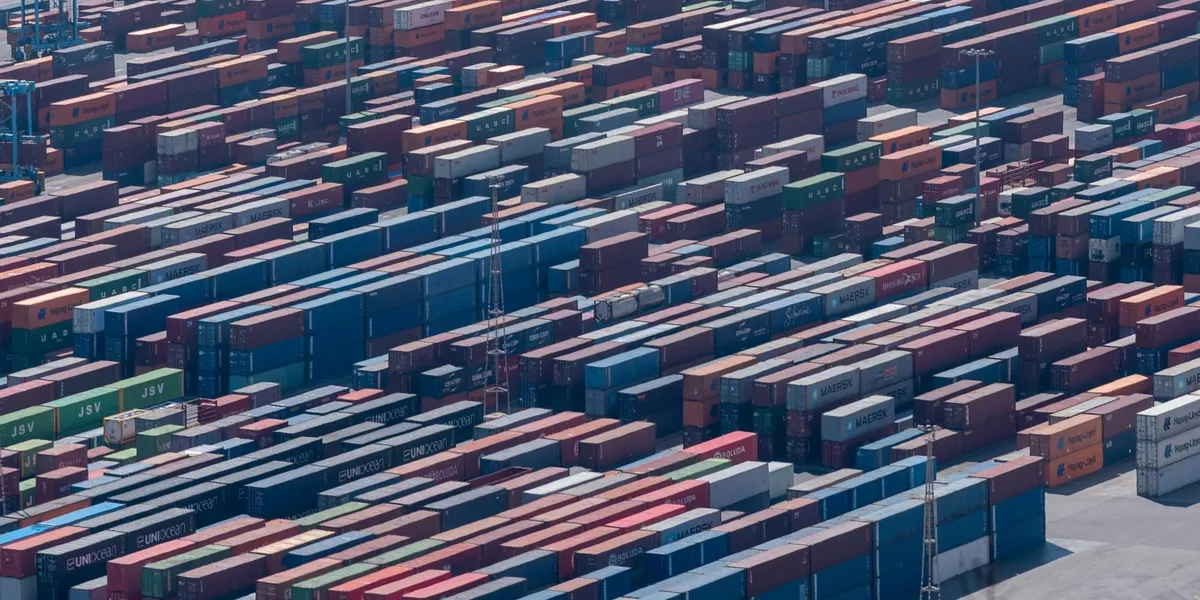 Container vessel at port representing customs broker and trade compliance marketing