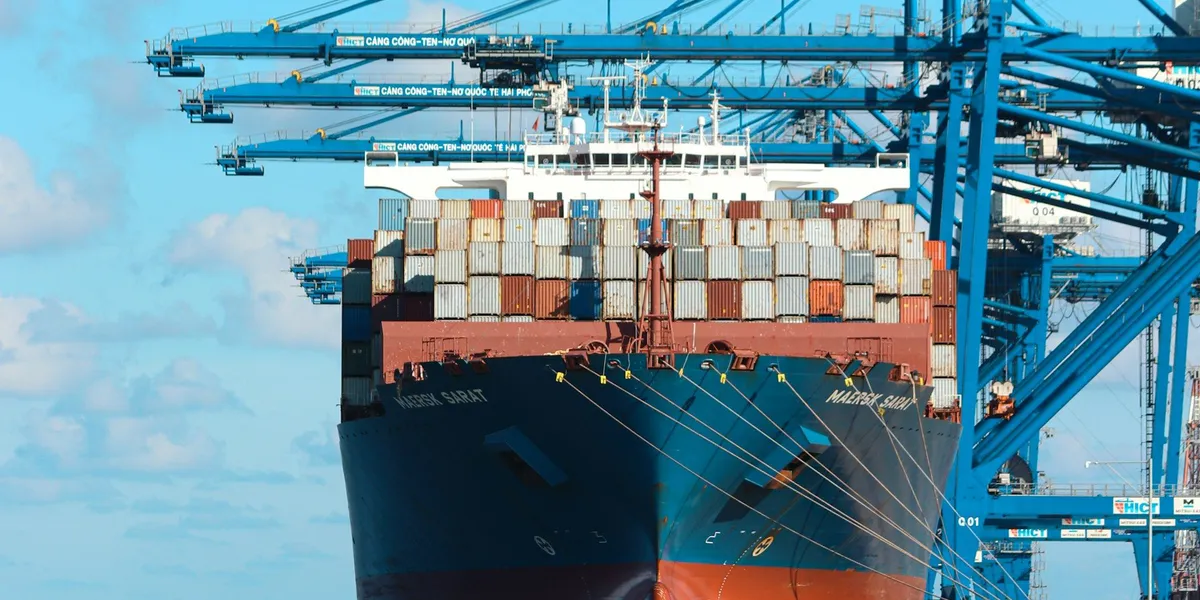 Container ship docked at a freight port at dusk