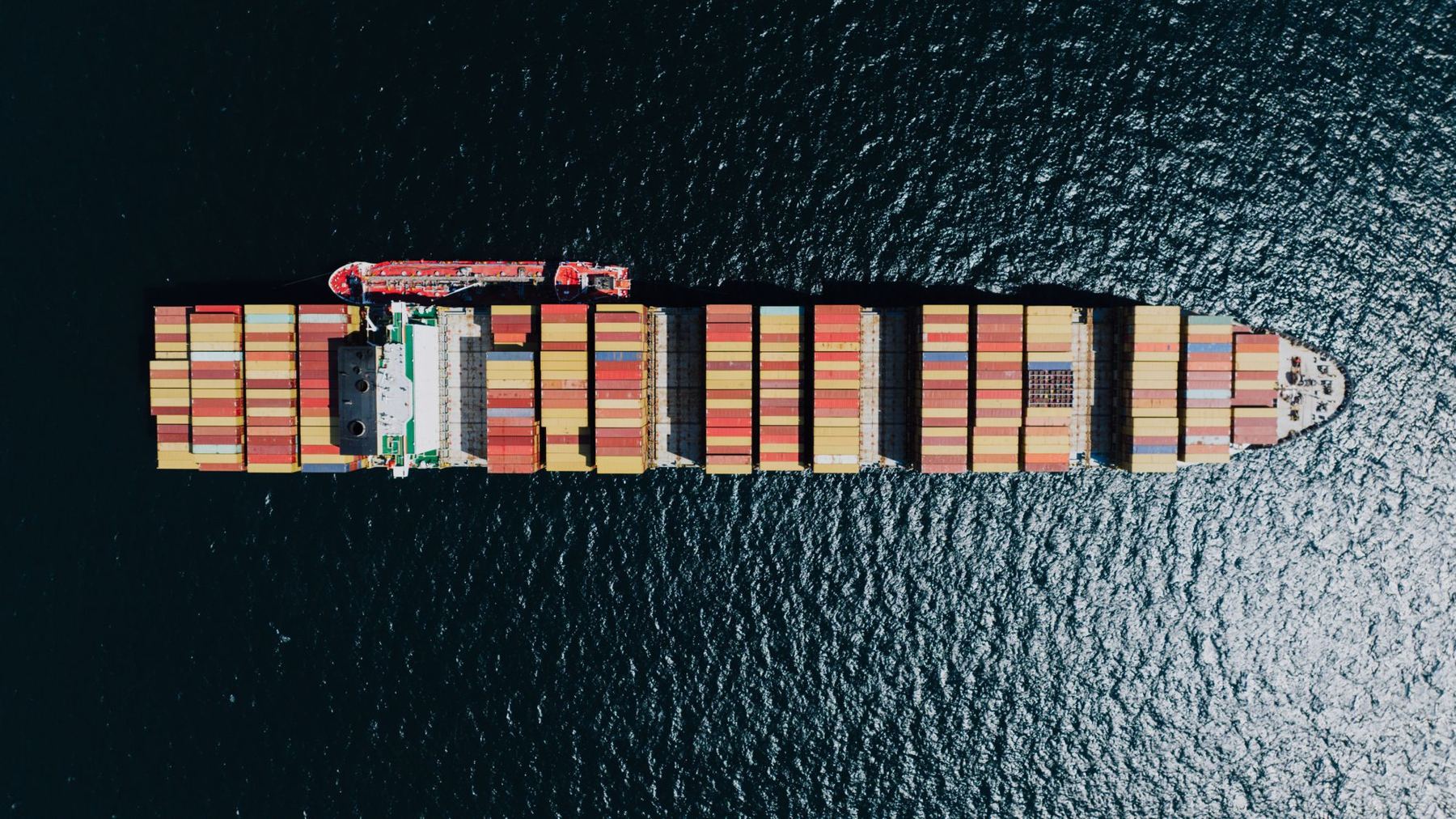 Aerial view of a loaded container ship at sea