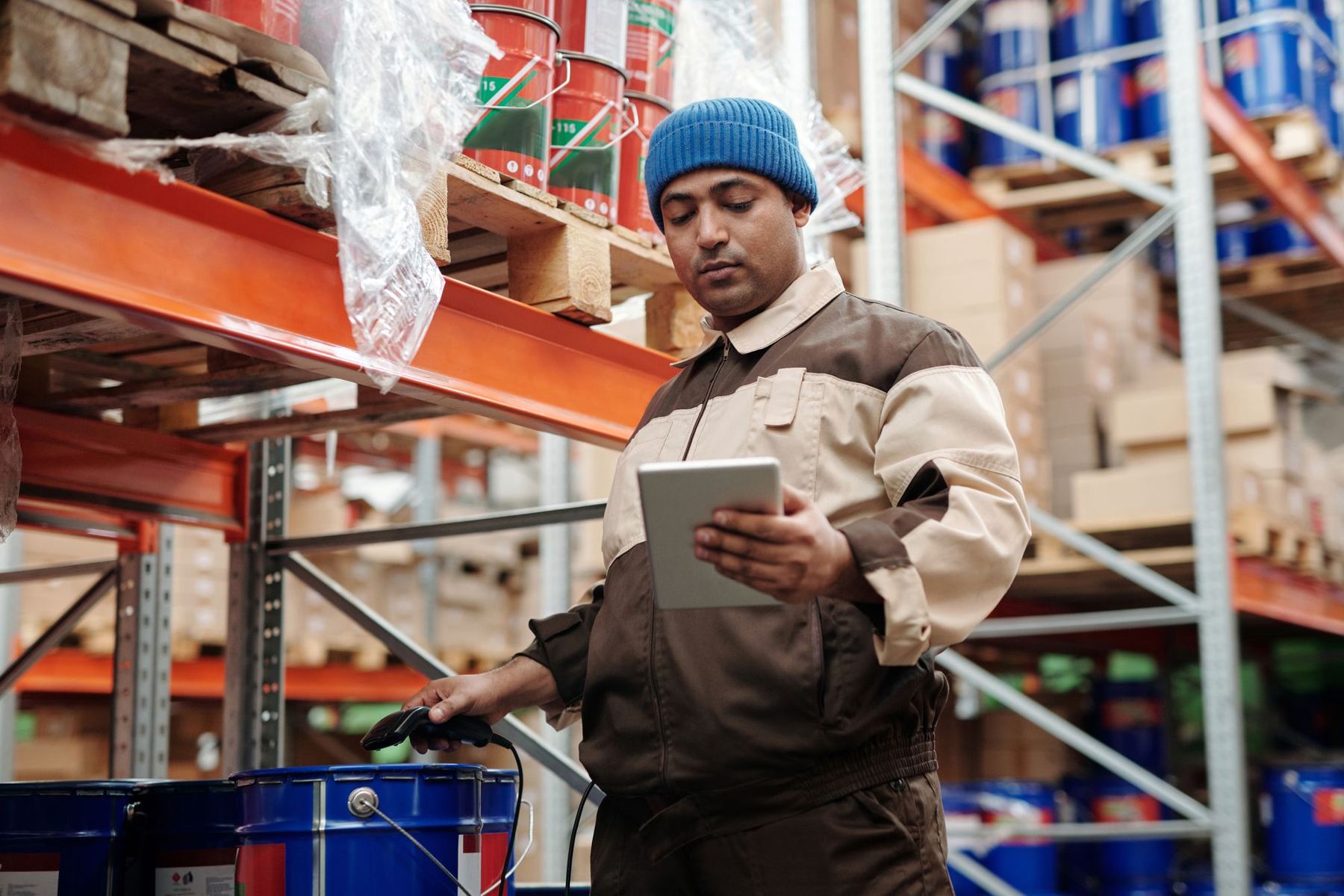 Warehouse worker checking inventory on a tablet
